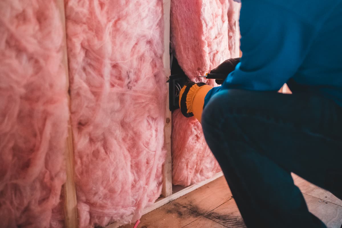 Mineral wool insulation fitted between roof rafters in a loft