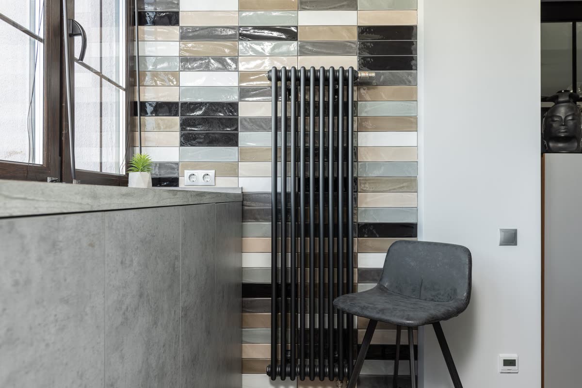 A slim modern radiator in a recently refurbished room